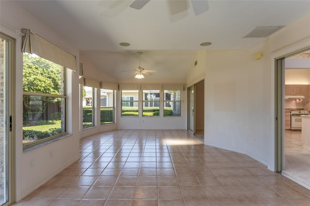 unfurnished sunroom with visible vents, lofted ceiling, and ceiling fan