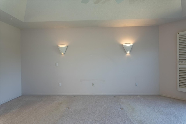 empty room with light carpet and baseboards