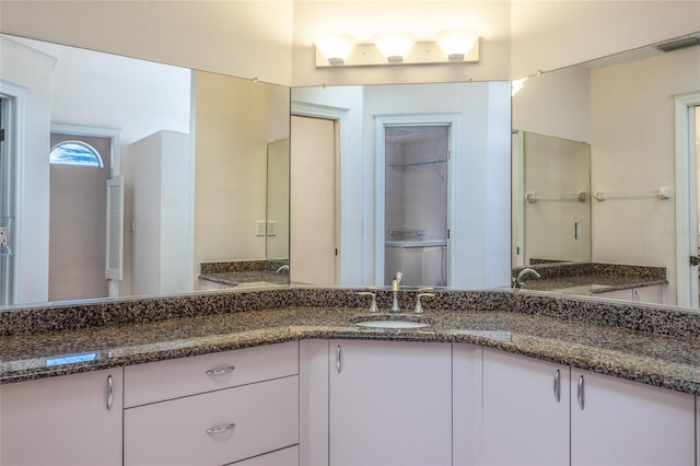 bathroom with visible vents and vanity