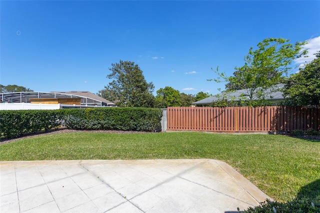 view of yard with a patio and fence