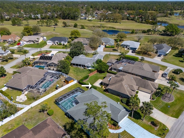 birds eye view of property with a residential view, view of golf course, and a water view