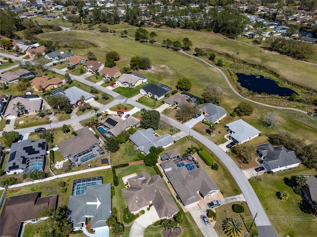 bird's eye view with a residential view, a water view, and view of golf course