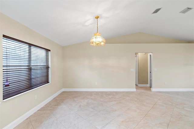 unfurnished room with vaulted ceiling, light tile patterned flooring, baseboards, and visible vents