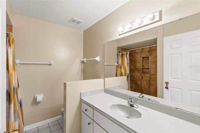 full bathroom with vanity, visible vents, tile patterned flooring, a textured ceiling, and toilet