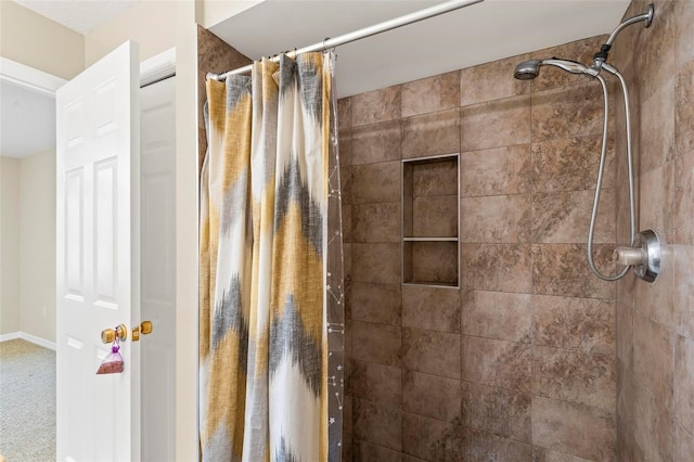 bathroom featuring a tile shower