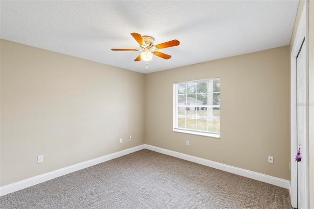 unfurnished bedroom featuring a closet, baseboards, carpet, and ceiling fan