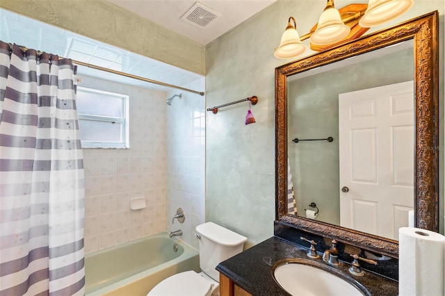 bathroom with visible vents, toilet, shower / bath combo, and vanity