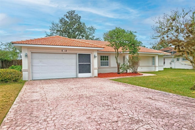 view of front of house with a front lawn, a tiled roof, stucco siding, decorative driveway, and an attached garage