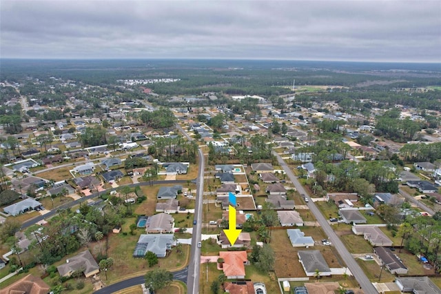 birds eye view of property with a residential view