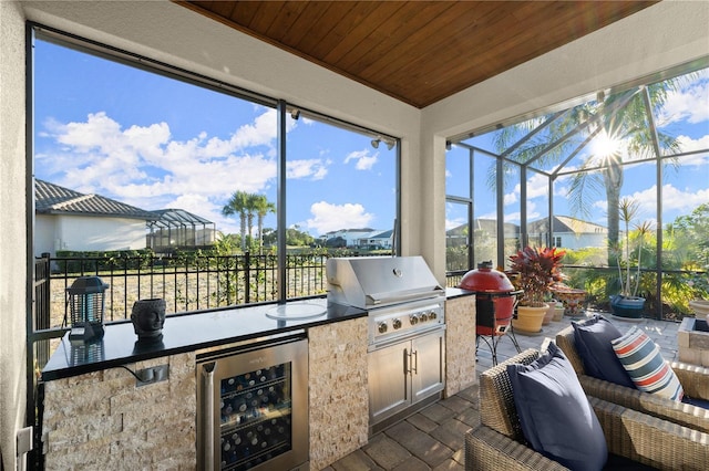 sunroom / solarium featuring wine cooler, wood ceiling, and a healthy amount of sunlight