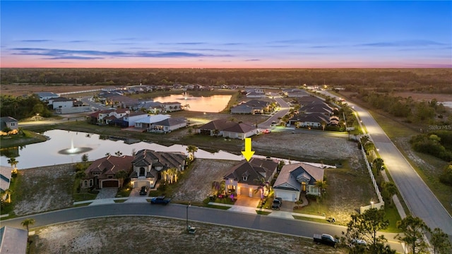 aerial view with a residential view and a water view