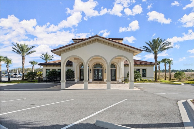 view of property featuring uncovered parking