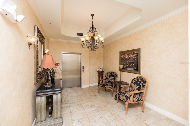 living area with a tray ceiling, elevator, visible vents, and baseboards