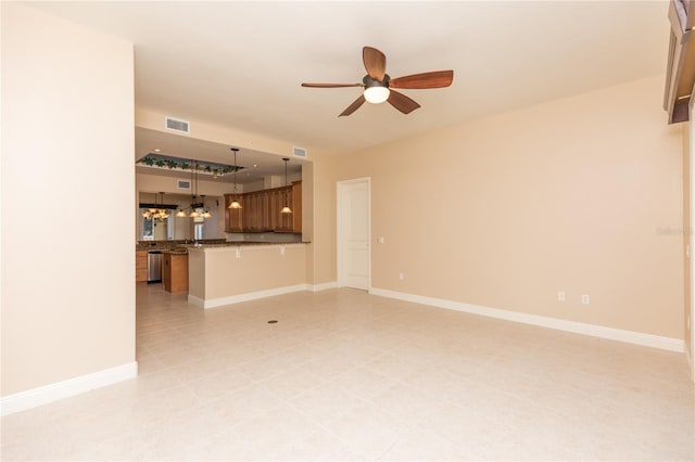 unfurnished living room featuring visible vents, baseboards, and ceiling fan with notable chandelier