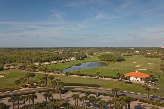 aerial view with golf course view and a water view