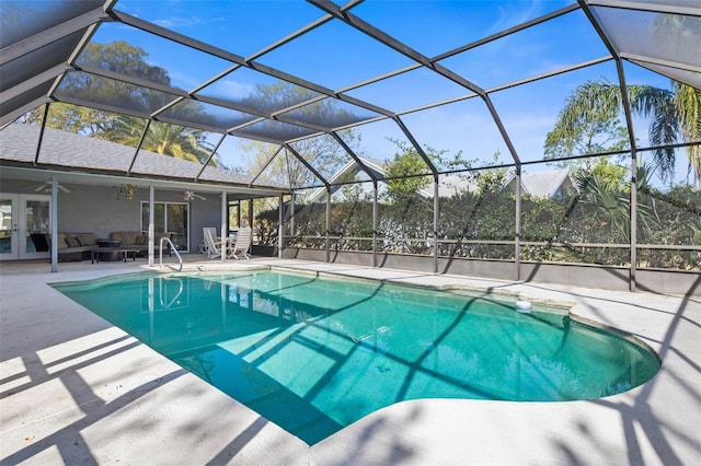 outdoor pool featuring a ceiling fan, a patio, french doors, glass enclosure, and outdoor lounge area