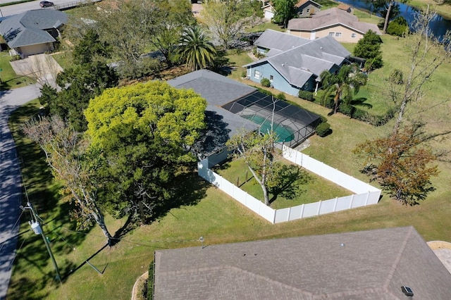 drone / aerial view featuring a residential view and a water view