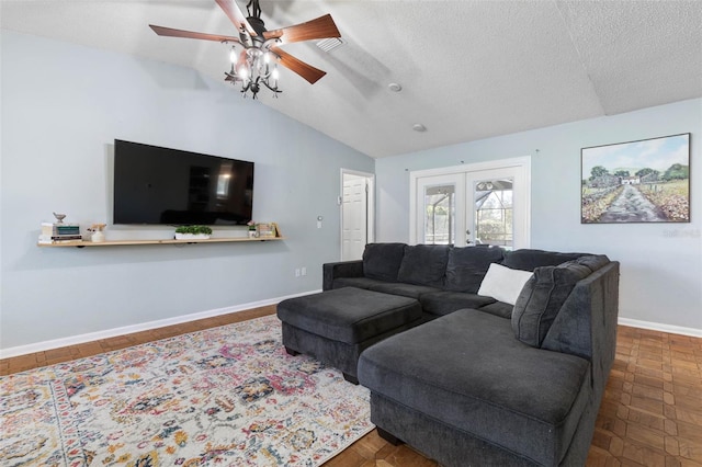 living area featuring baseboards, ceiling fan, vaulted ceiling, french doors, and a textured ceiling