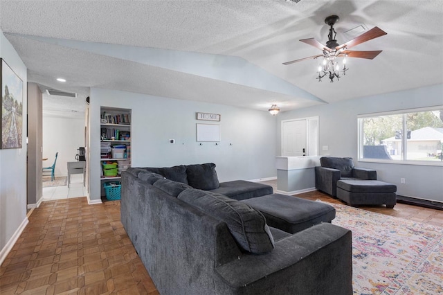 living area featuring a textured ceiling, a ceiling fan, baseboards, and vaulted ceiling