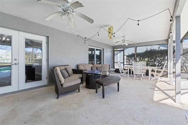 view of patio / terrace with ceiling fan, french doors, outdoor dining space, and outdoor lounge area