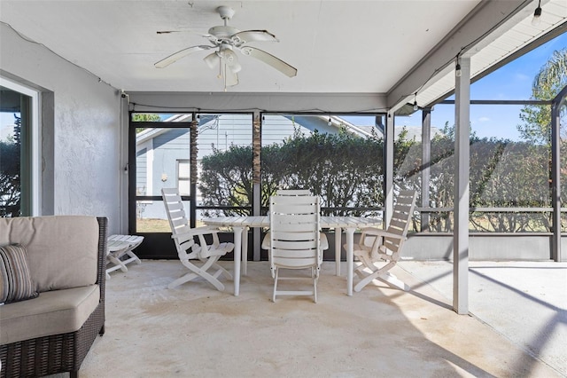 sunroom / solarium featuring a wealth of natural light and a ceiling fan