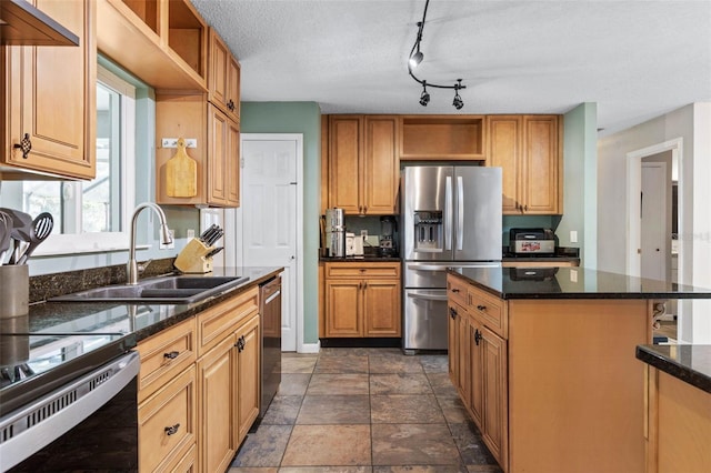 kitchen featuring a kitchen island, open shelves, dark stone counters, a sink, and appliances with stainless steel finishes