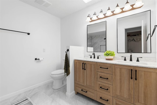 bathroom with visible vents, toilet, walk in shower, and a sink