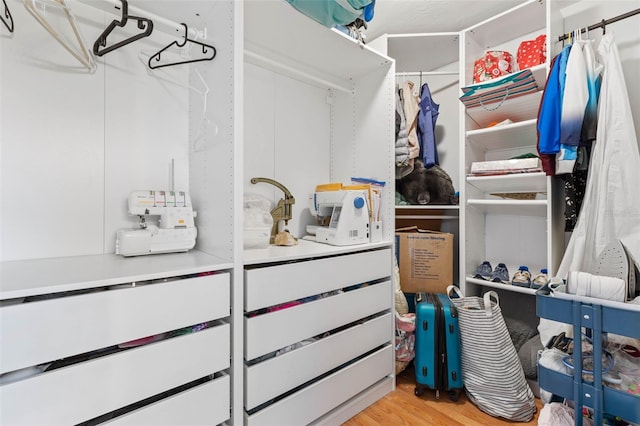 spacious closet featuring light wood finished floors