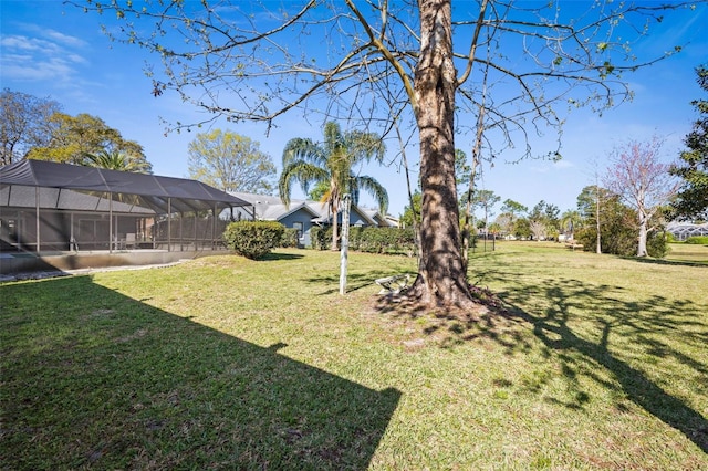 view of yard featuring glass enclosure