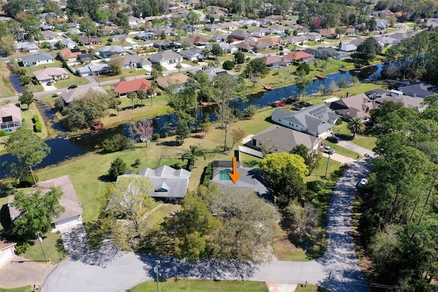 bird's eye view featuring a residential view and a water view