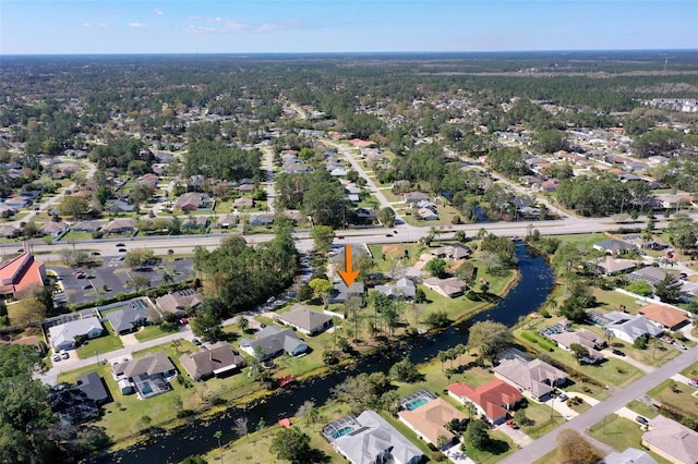 aerial view with a residential view and a water view