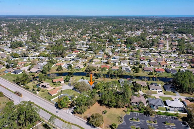 birds eye view of property with a residential view