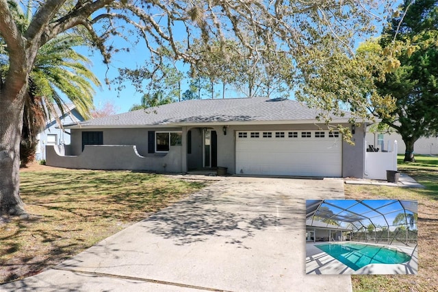 ranch-style house featuring a lanai, concrete driveway, roof with shingles, stucco siding, and an attached garage