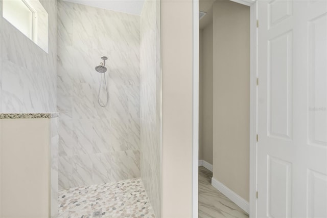 full bathroom featuring a marble finish shower, baseboards, and marble finish floor