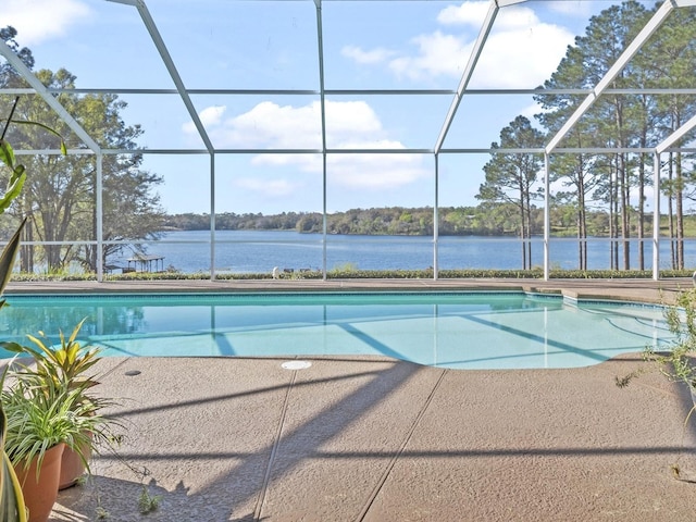 pool with a lanai and a patio area