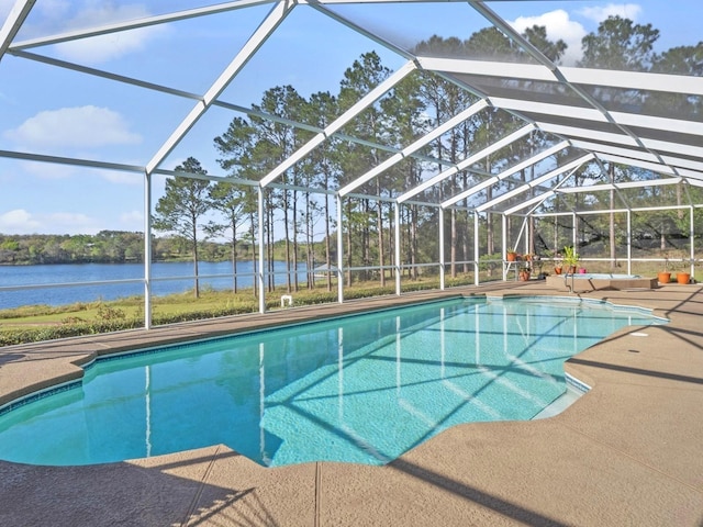 outdoor pool with a lanai, a water view, and a patio