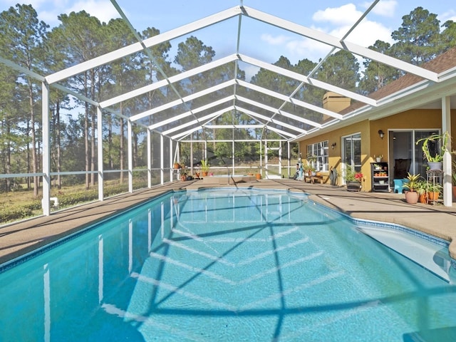 pool with a patio area and a lanai