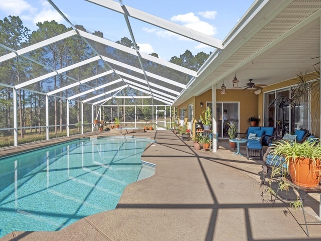 pool featuring a patio area, a lanai, and ceiling fan