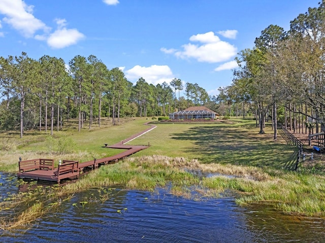 dock area featuring a yard and a water view