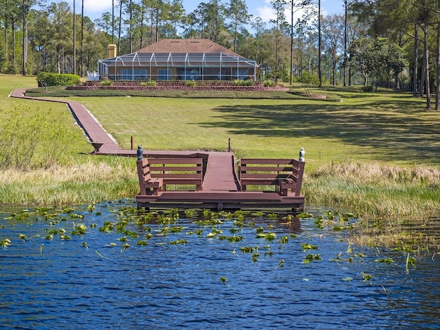 view of community featuring a yard and a water view