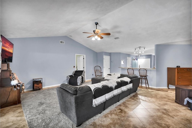 living area featuring vaulted ceiling, baseboards, visible vents, and ceiling fan