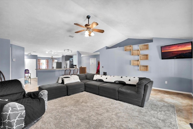 living area featuring visible vents, lofted ceiling, a ceiling fan, rail lighting, and baseboards