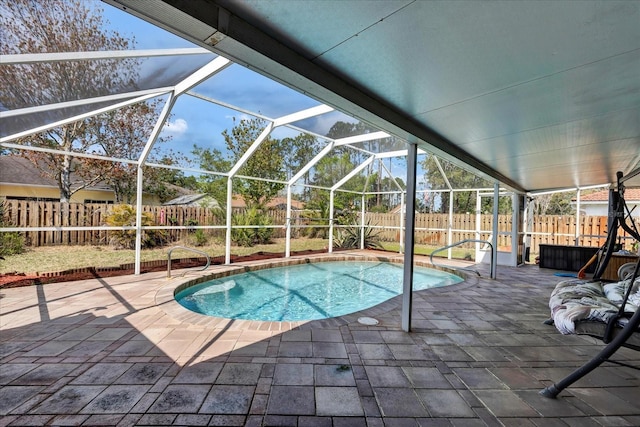 view of swimming pool with a fenced backyard, a fenced in pool, a lanai, and a patio