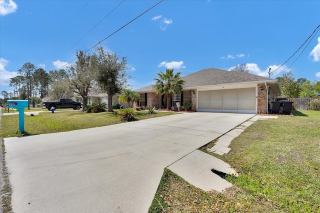 ranch-style house featuring brick siding, a garage, driveway, and a front lawn