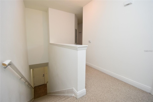 staircase with carpet and baseboards