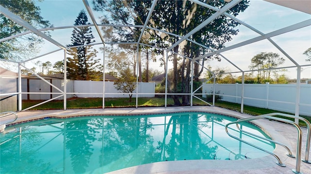 view of pool featuring a lanai, a fenced in pool, and a fenced backyard