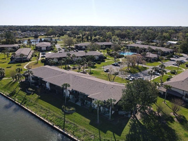 bird's eye view featuring a residential view and a water view