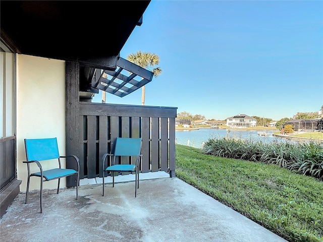 view of patio with a water view