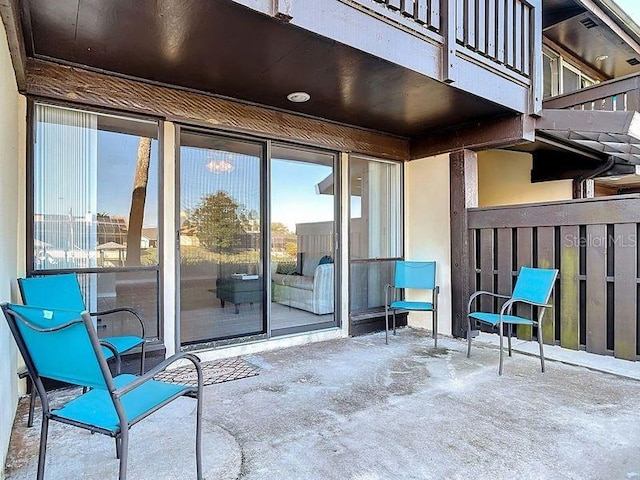 view of patio featuring a balcony