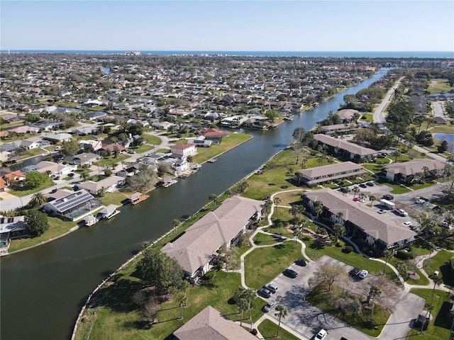 aerial view with a water view and a residential view